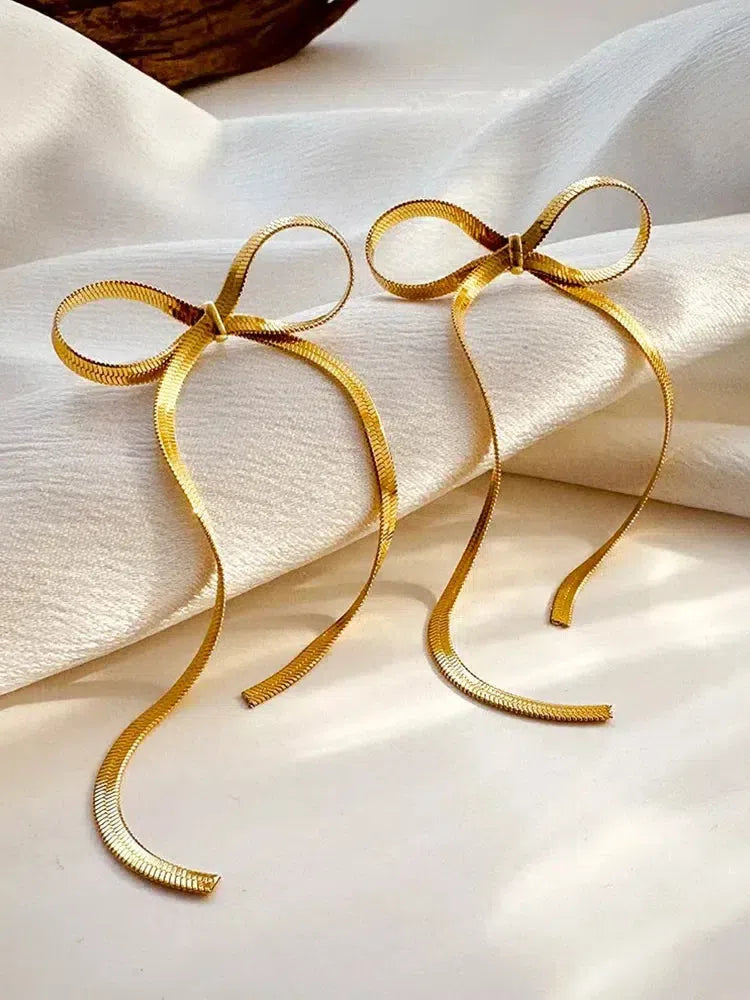 Sabella – Akcenty kokardy – Kolczyki z łańcuszkiem typu snake